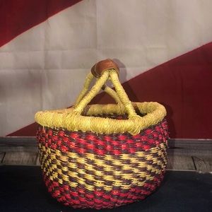 Vintage bolga wicker basket & leather accents.
